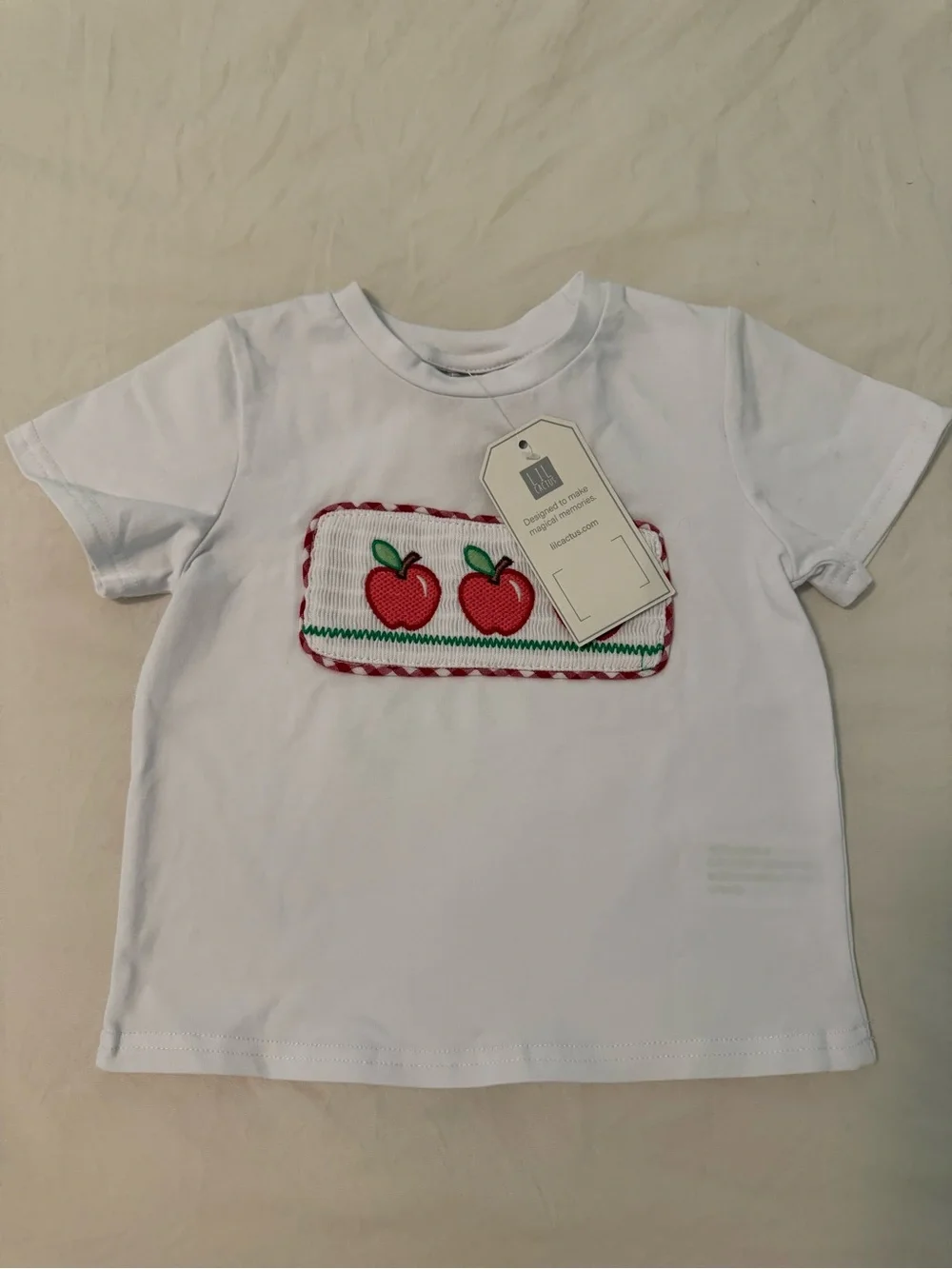 Embroidered set. Red apples and gingham red and white short. So cute!
